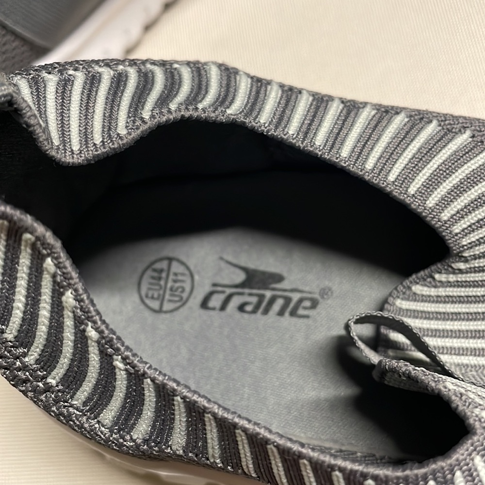 Crane athletic shoes, size 11. It’s made from  a very light and soft material.